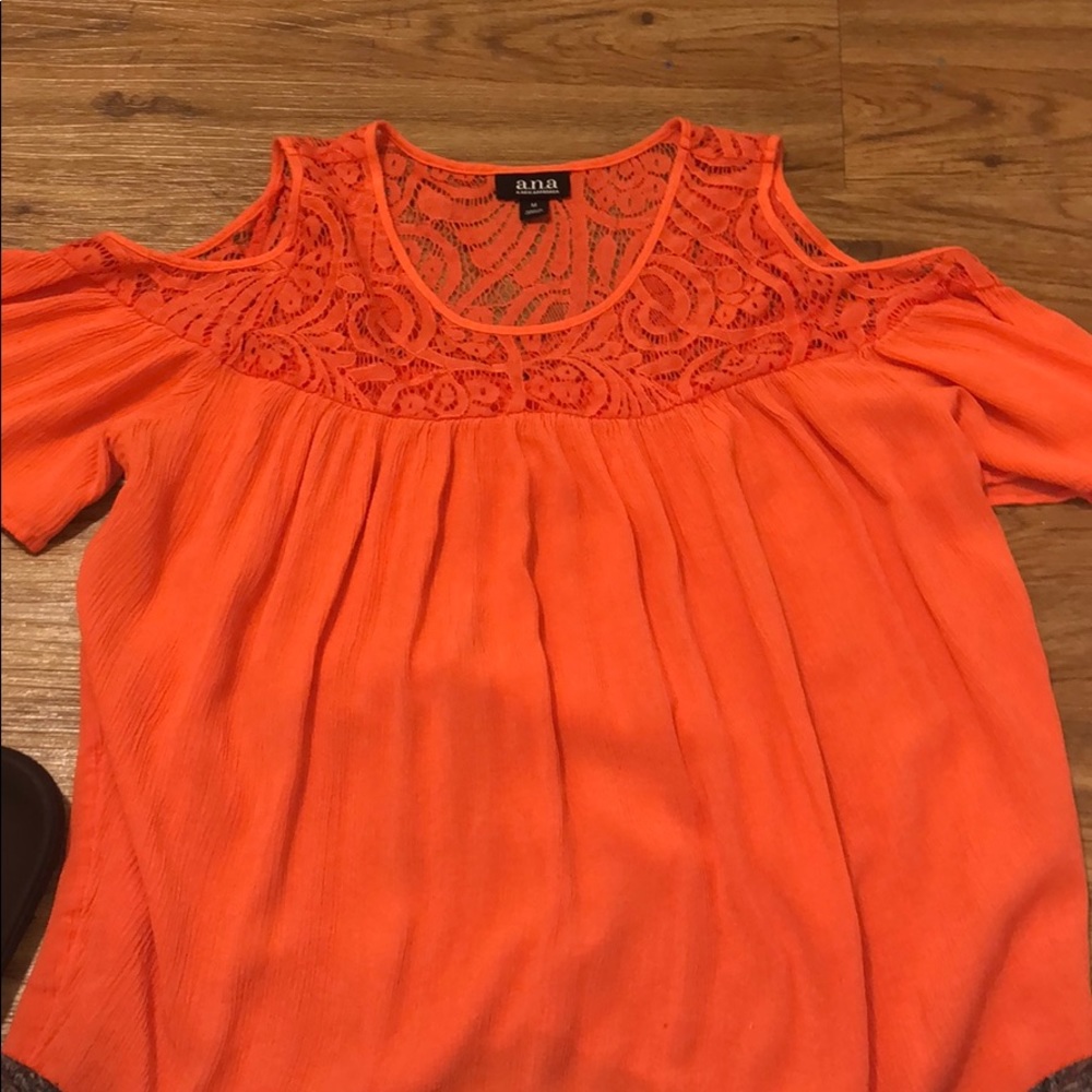 a peach colored blouse